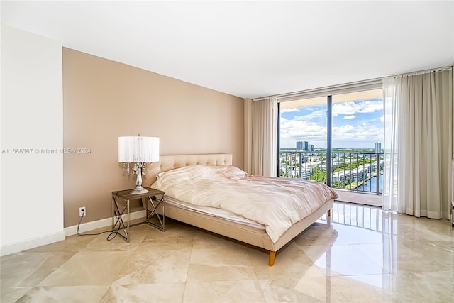 bedroom featuring access to exterior and expansive windows