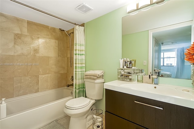 full bathroom featuring shower / bath combo, tile patterned flooring, vanity, and toilet