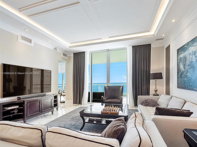 living room featuring a water view and crown molding