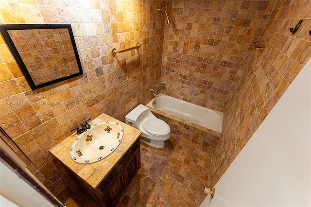 full bathroom with vanity, tiled shower / bath combo, and toilet