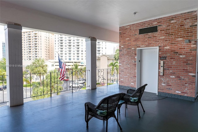 455 Paradise Isle Blvd Unit 402, Hallandale Beach, FL 33009 - view of patio / terrace with a balcony and elevator