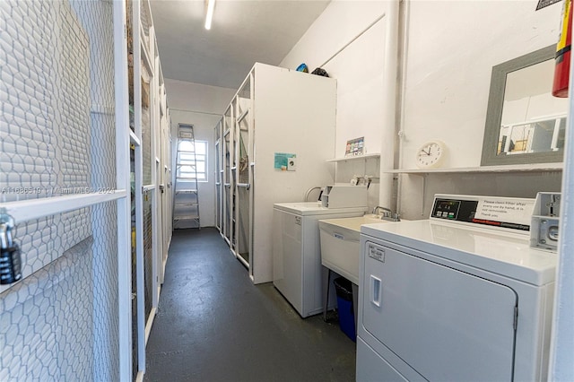 laundry room featuring separate washer and dryer