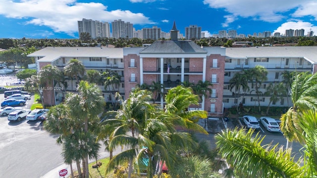 455 Paradise Isle Blvd Unit 402, Hallandale Beach, FL 33009 - view of property with a view of skyline and uncovered parking