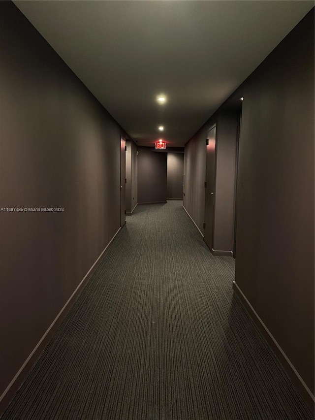 corridor with dark carpet