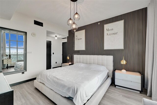 bedroom with light wood-type flooring