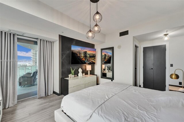 bedroom featuring light hardwood / wood-style floors