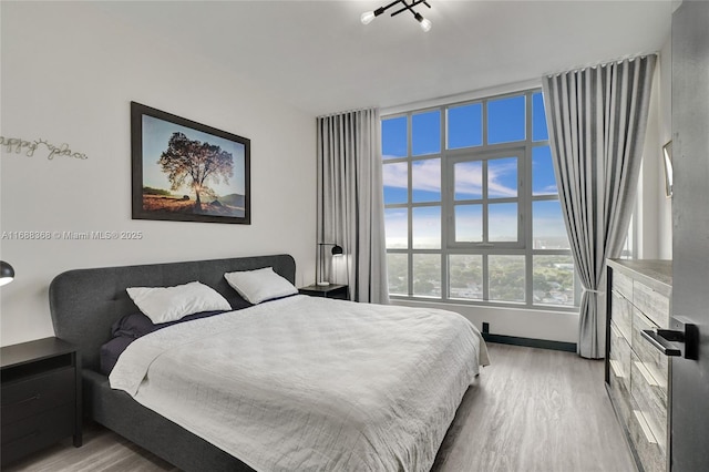 bedroom with light wood-type flooring