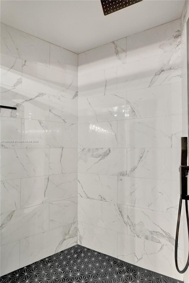 bathroom with tiled shower