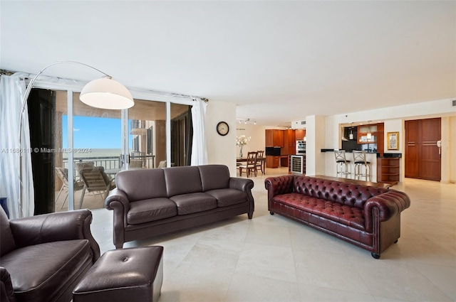 living room featuring floor to ceiling windows