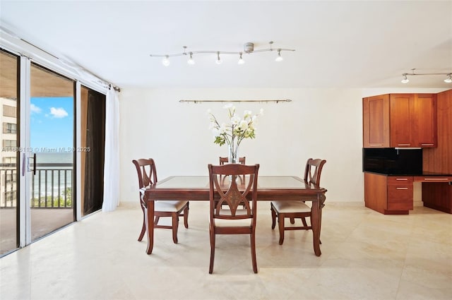 10175 Collins Ave Unit 1003, Bal Harbour, FL 33154 - dining area with rail lighting