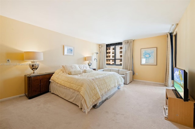 bedroom featuring light carpet