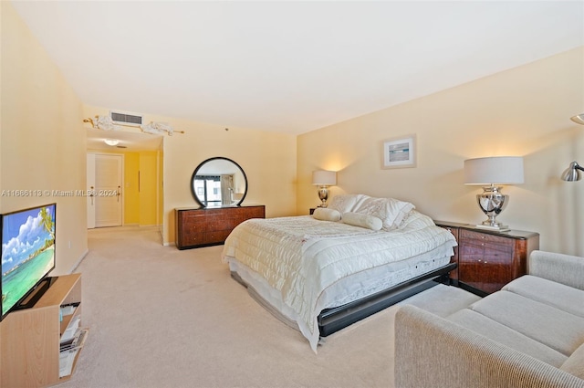 bedroom with light carpet