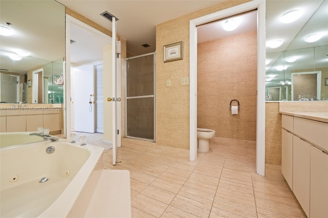 full bathroom featuring tile patterned floors, vanity, toilet, and shower with separate bathtub