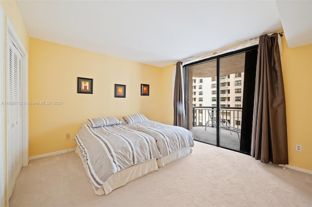 bedroom with access to outside, light colored carpet, and a closet