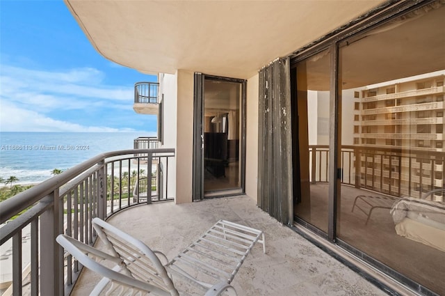 balcony featuring a water view