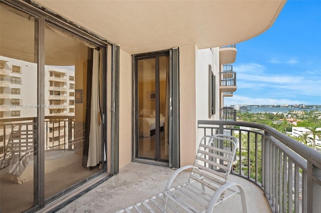 balcony featuring a water view