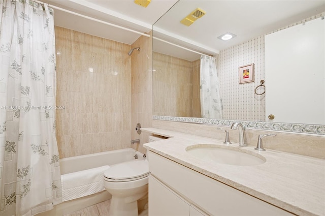 full bathroom with shower / bath combo, tile patterned flooring, vanity, and toilet