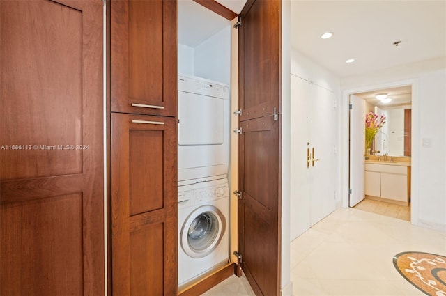 washroom with stacked washer / dryer