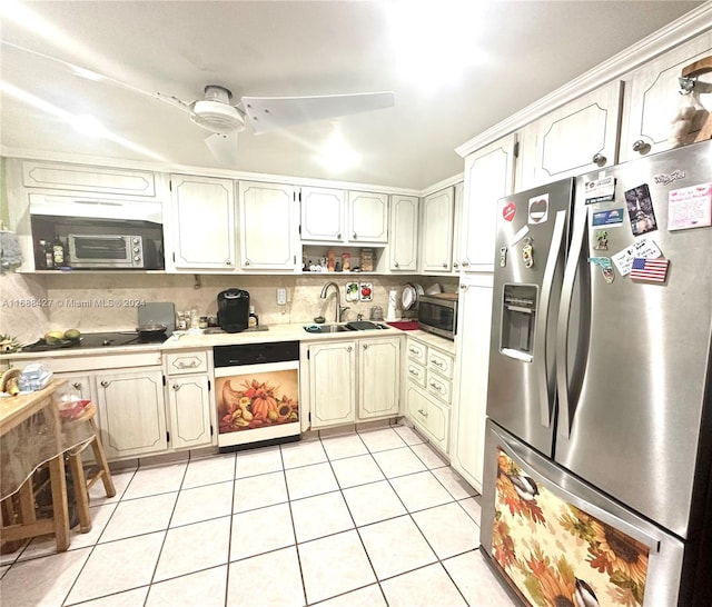 kitchen featuring light tile patterned floors, sink, decorative backsplash, and appliances with stainless steel finishes