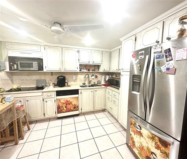 1811 Jefferson St Unit 210, Hollywood, FL 33020 - kitchen with appliances with stainless steel finishes, light countertops, light tile patterned floors, and tasteful backsplash