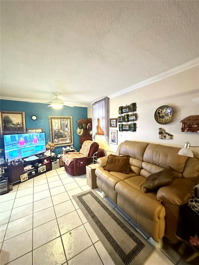 tiled living room with ceiling fan, a textured ceiling, and crown molding