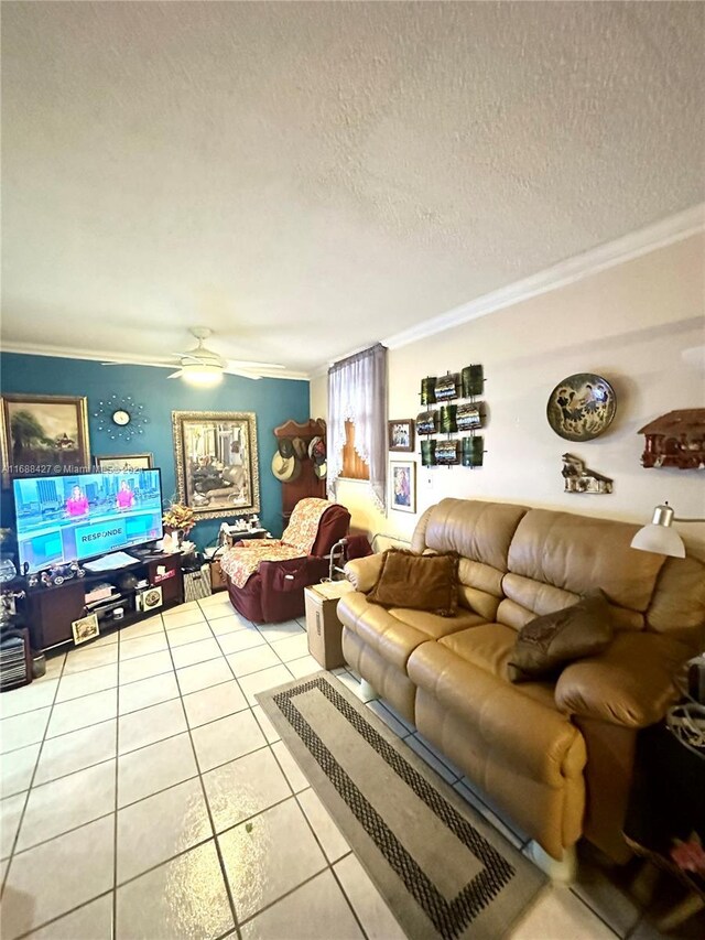 1811 Jefferson St Unit 210, Hollywood, FL 33020 - living room featuring ornamental molding, tile patterned floors, a ceiling fan, and a textured ceiling