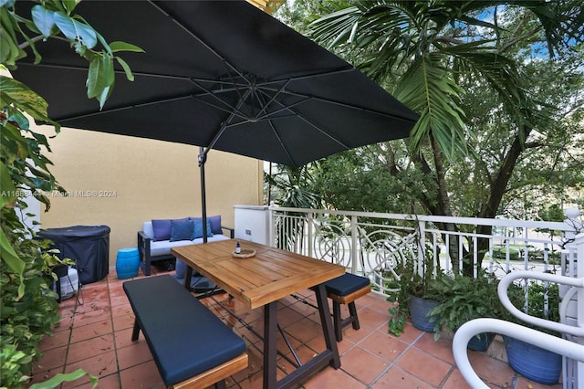 view of patio featuring a balcony