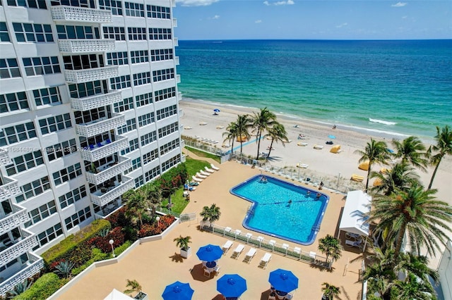 birds eye view of property featuring a view of the beach and a water view