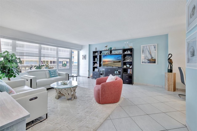 living room featuring a textured ceiling and light tile patterned floors