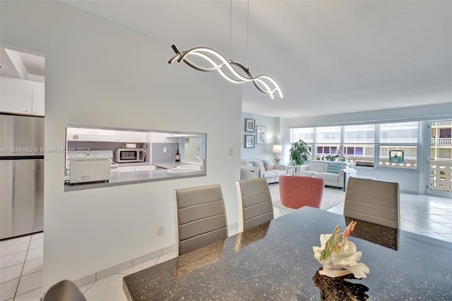 tiled dining area with sink