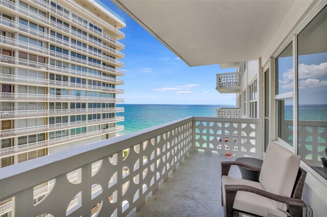 balcony featuring a water view