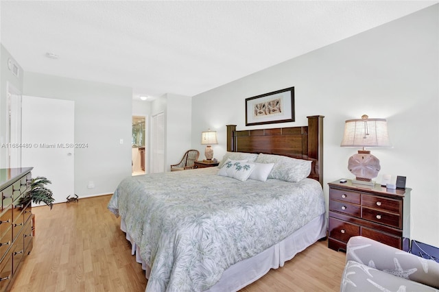 bedroom with light hardwood / wood-style flooring