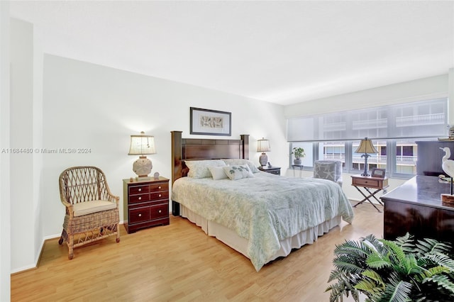 bedroom with hardwood / wood-style flooring