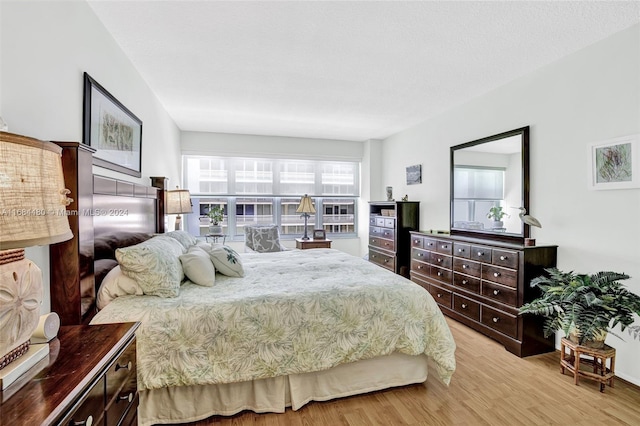 bedroom with light hardwood / wood-style flooring