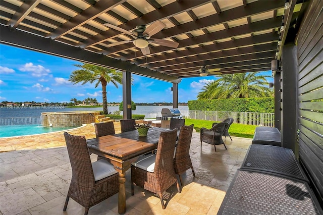 view of patio featuring pool water feature, ceiling fan, a water view, and a fenced in pool