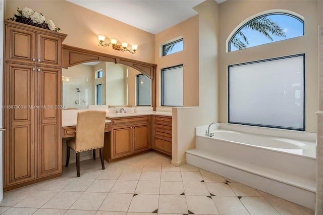 bathroom featuring tile patterned floors, vanity, plus walk in shower, and a wealth of natural light