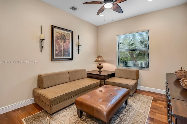 living room with ceiling fan and hardwood / wood-style flooring