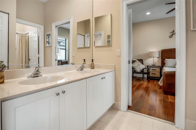 bathroom with vanity and hardwood / wood-style flooring