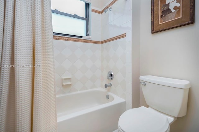 bathroom featuring toilet and shower / tub combo