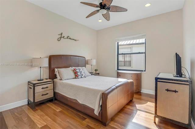 bedroom featuring ceiling fan and light hardwood / wood-style floors