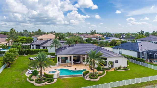 back of house featuring a gazebo, a patio area, a fenced in pool, and a yard