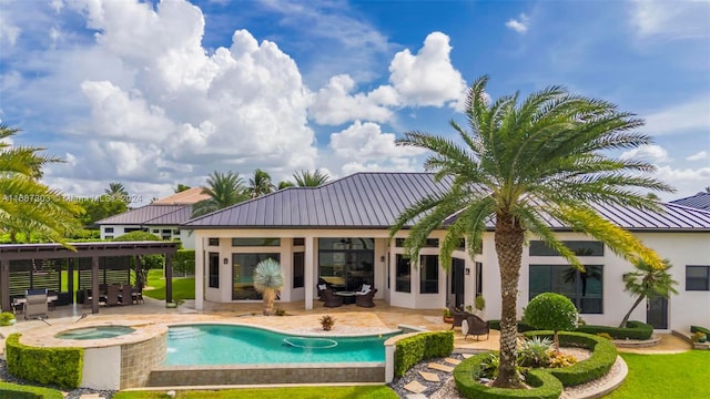 view of pool featuring a patio area and an in ground hot tub