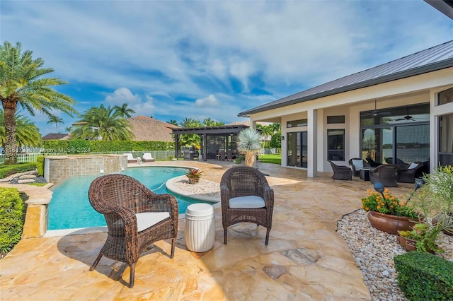 view of swimming pool featuring a patio area and ceiling fan