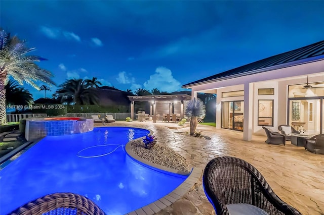 view of pool featuring ceiling fan, an in ground hot tub, and a patio