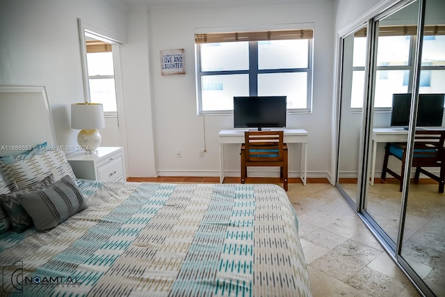 bedroom featuring multiple windows