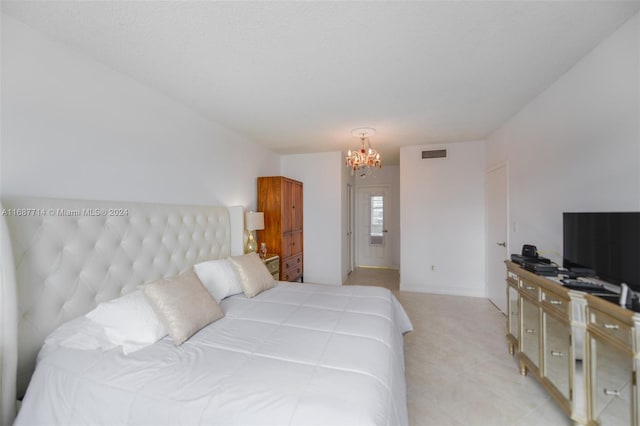 bedroom with an inviting chandelier