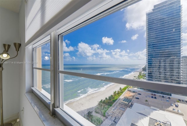 balcony with a view of the beach and a water view