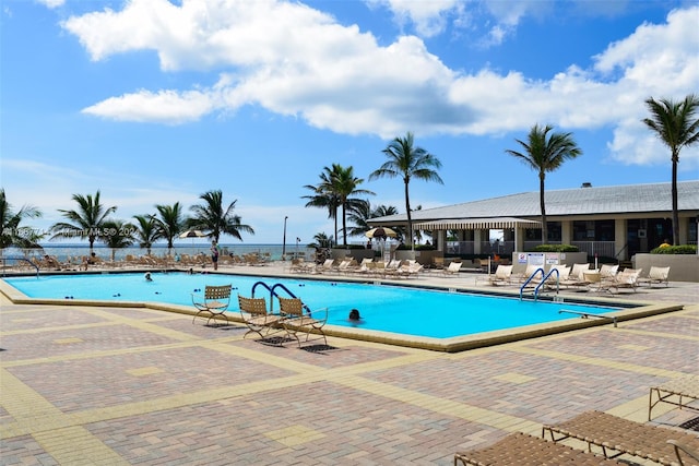 view of swimming pool with a patio