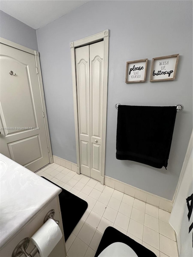 bathroom with tile patterned flooring