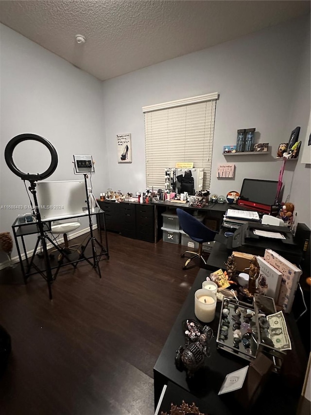 home office featuring a textured ceiling and dark hardwood / wood-style floors